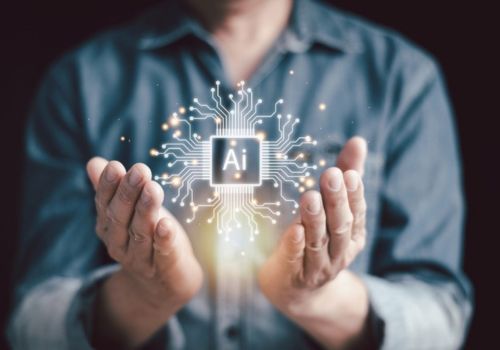 man with hands open holding AI image