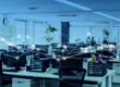 an empty office with a graphic depicting how all the desktop computers are connected