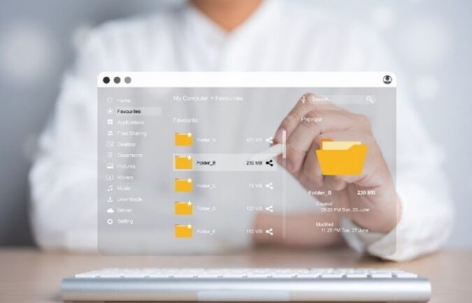 1st June Blog – The Best Practices for Secure File Sharing – feature – final person sitting behind a transparent screen, image of file sharing taking place
